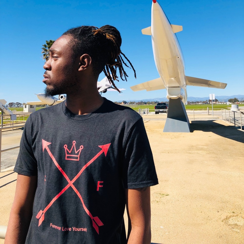 F.L.Y. Arrow cross shirt.